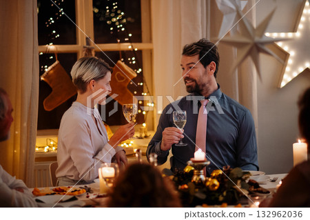 Christmas romance for couple, toastinig with wine. 132962036