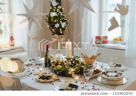 A table set for dinner meal at Christmas time. 132962050