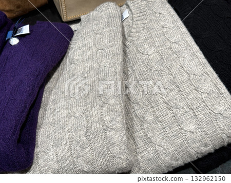 Elegant folded wool sweater on display Elegant folded wool sweater on display 132962150