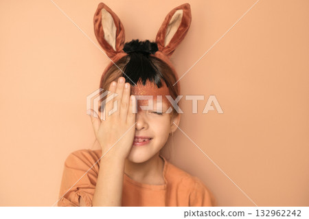 A sweet, sensual girl with brown horse ears and makeup on her face hides behind her palm. The symbol of the new year 2026 according to the Eastern calendar A sweet, sensual girl with brown horse ears and makeup on her face hides behind her palm. The symbol of the new year 2026 according to the Eastern calendar 132962242