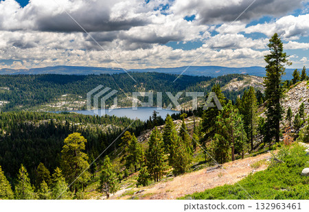 Scenic view of Bear River Reservoir from Peddler Hill Overlook in the Sierra Nevada mountains, California. Pine forests cover the hills under a dramatic cloudy sky. Represents nature and wilderness Scenic view of Bear River Reservoir from Peddler Hill Overlook in the Sierra Nevada mountains, California. Pine forests cover the hills under a dramatic cloudy sky. Represents nature and wilderness 132963461