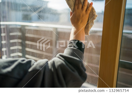 Housewife cleaning windows 132965754