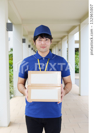 Male carrying baggage Male carrying baggage 132965807