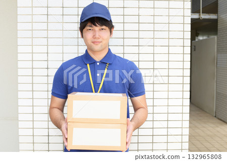 Male carrying baggage Male carrying baggage 132965808