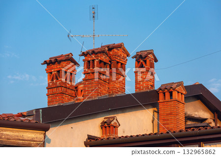 Brick chimneys on roof, Bergamo, Lombardy, Italy 132965862