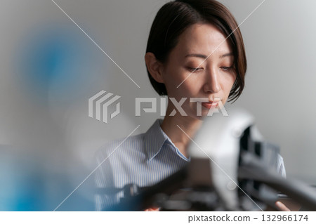 A person who inspects and maintains drones 132966174