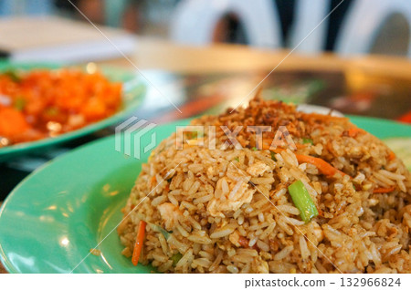 Traditional Malaysian fried rice with a strong soy sauce flavor 132966824