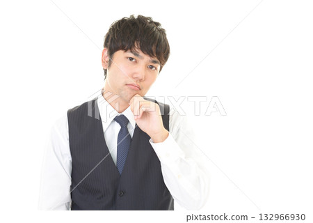 A worried man wearing a vest 132966930