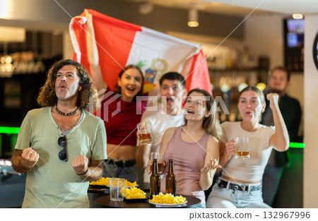 Group of fans in bar with Peruvian flag Group of fans in bar with Peruvian flag 132967996