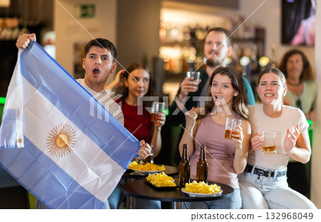 Group of fans in bar with Argentina flag 132968049