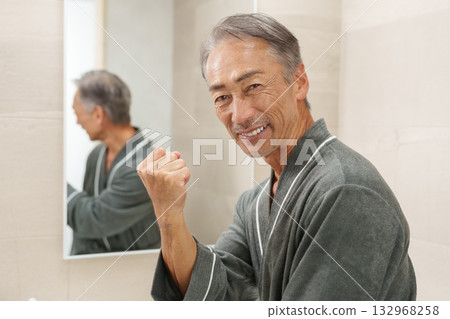 Smiling senior man in the bathroom Smiling senior man in the bathroom 132968258