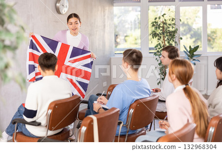 Female student telling coursemates about United Kingdom at lecture Female student telling coursemates about United Kingdom at lecture 132968304