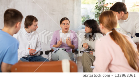 Teenagers communicate with the teacher in a free form during lesson at school Teenagers communicate with the teacher in a free form during lesson at school 132968361