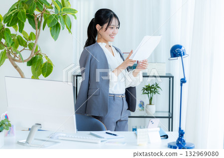 Businesswoman with document Businesswoman with document 132969080