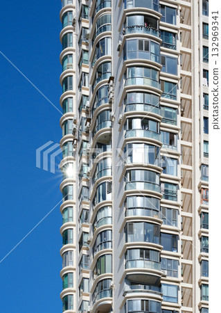 City apartment buildings under blue sky and sunshine 132969341