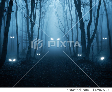 A horror scene with glowing eyes floating in a spooky forest shrouded in blue fog. A work of art with a fantastical and mysterious atmosphere. Hallow 132969725