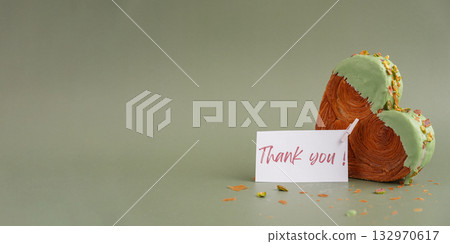 THANK YOU text thanksgiving day Delightful and vibrant heartshaped pastry croissant treat, beautifully topped with colorful frosting nut galore. Mock up template copy space. Food experimentation viral THANK YOU text thanksgiving day Delightful and vibrant heartshaped pastry croissant treat, beautifully topped with colorful frosting nut galore. Mock up template copy space. Food experimentation viral 132970617