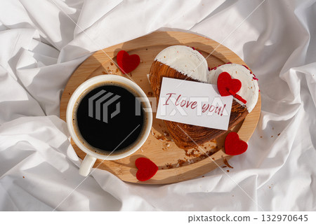 I LOVE YOU text message paper note card Morning breakfast Valentine's Day Birthday celebration Delicious fresh variety croissants topped with colorful flavor Ganache. Creation unique heart shape 132970645