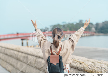 Woman tourist sightseeing Fukuura jima bridge or the bridge of romantic encounters for Fukuura Island at Matsushima Bay in Matsushima, Miyagi Prefecture, Tohoku, Japan. Landmark and famous Vacation Woman tourist sightseeing Fukuura jima bridge or the bridge of romantic encounters for Fukuura Island at Matsushima Bay in Matsushima, Miyagi Prefecture, Tohoku, Japan. Landmark and famous Vacation 132970949