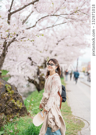 Woman tourist sightseeing Hirosaki Castle park with Sakura Cherry Blossom in Spring, traveler travel in Hirosaki city, Aomori, Tohoku, Japan. Landmark famous in Japan. Travel and Vacation destination Woman tourist sightseeing Hirosaki Castle park with Sakura Cherry Blossom in Spring, traveler travel in Hirosaki city, Aomori, Tohoku, Japan. Landmark famous in Japan. Travel and Vacation destination 132971018