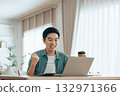 Funny euphoric young asian man celebrating winning or getting ecommerce shopping 132971366