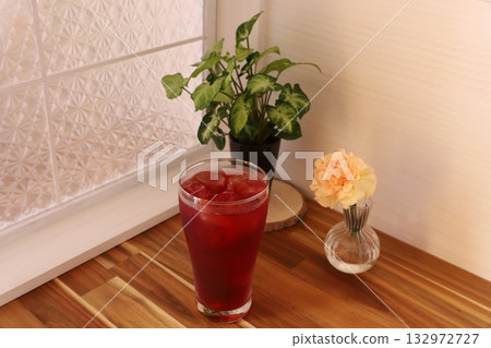 A vibrant red drink 132972727