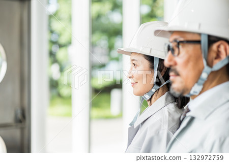 Middle-aged and senior male and female site supervisors. 132972759