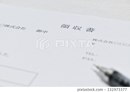 A simple composition of receipts and stationery 132973377