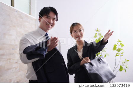 Young businessman and businesswoman going out on a business trip 132973419