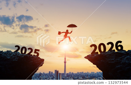 Businessman jumping over the valley to 2026 Business New Year's image for 2026 Reiwa 8 New Year's card material 132973544