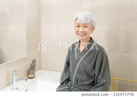 Senior woman in the bathroom (beauty and skin care) 132973776
