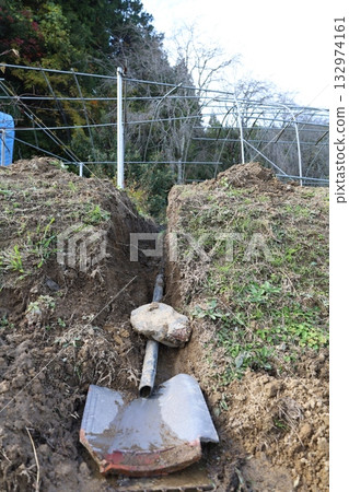 Piping and water supply construction work on farmland 132974161