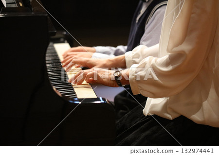 Playing the piano Playing the piano 132974441