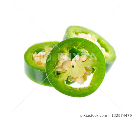 Fresh jalapeno pepper isolated on white background. Slices of green hot serrano pepper. Clipping path. Fresh jalapeno pepper isolated on white background. Slices of green hot serrano pepper. Clipping path. 132974479