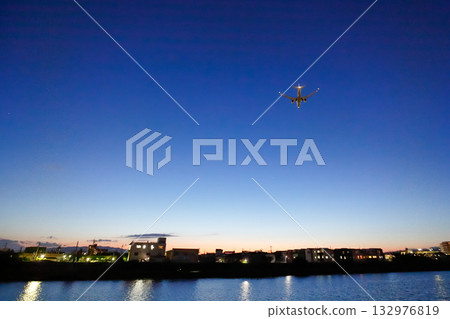 City lights and airplane lights 132976819