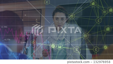 Interacting woman wearing glasses and scarf editing line charts on interface in design studio Interacting woman wearing glasses and scarf editing line charts on interface in design studio 132976958