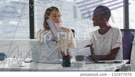 Analyzing charts business analysts discussing at office with laptop, papers, pens and coffee mugs Analyzing charts business analysts discussing at office with laptop, papers, pens and coffee mugs 132977078