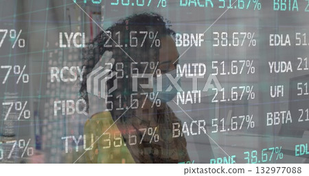 Female IT technician adjusting mask strap with glove in datacenter, blinking racks and data metrics 132977088