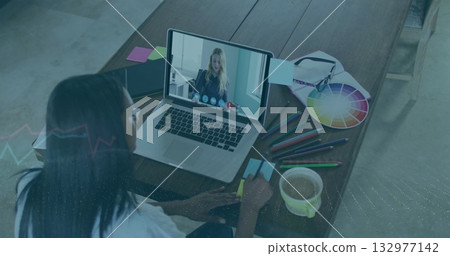 Taking notes female graphic designer attending meeting at home office desk, with laptop, copy space Taking notes female graphic designer attending meeting at home office desk, with laptop, copy space 132977142