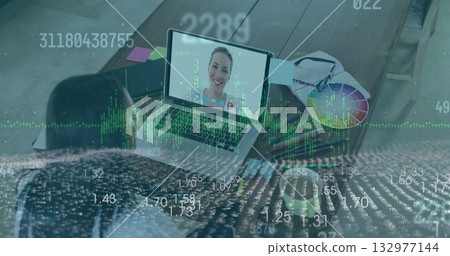Analyzing data with colleague wearing light blouse on laptop at studio, color wheel, data overlay Analyzing data with colleague wearing light blouse on laptop at studio, color wheel, data overlay 132977144