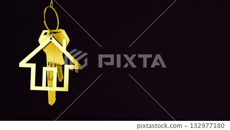 Suspending gold key ring with house-shaped keychain fob and metal keys in studio, copy space 132977180