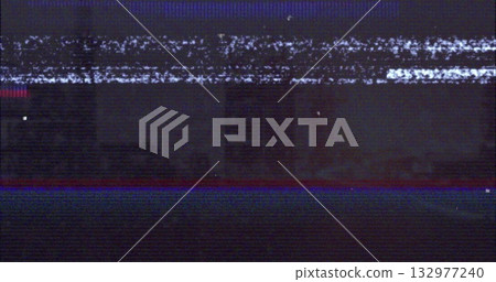 Flickering glitchy analog static filling vintage TV screen, showing red and blue glitch lines 132977240