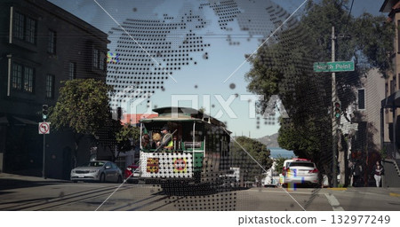 Descending green and white cable car carrying operator and passengers down city street, with rails Descending green and white cable car carrying operator and passengers down city street, with rails 132977249