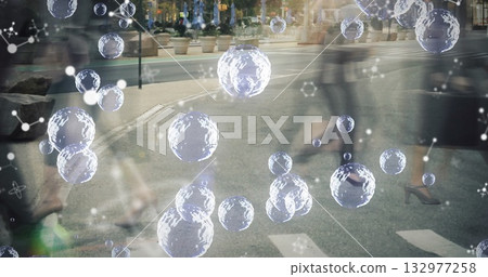 Floating 3D spheres and molecular diagrams at urban crosswalk with planters and storefront facades 132977258