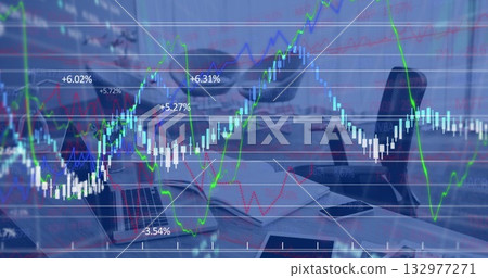 Showing transparent trading chart overlaying desk, with laptop, notebook, pen, mug and smartphone 132977271