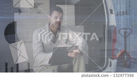 Holding clipboard and pen, delivery worker crouching inside cargo van, with digital overlay icons Holding clipboard and pen, delivery worker crouching inside cargo van, with digital overlay icons 132977398