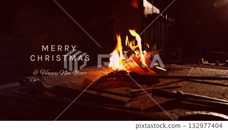 Fire of wooden kindling burning on metal worktable in workshop, with scattered debris, copy space 132977404