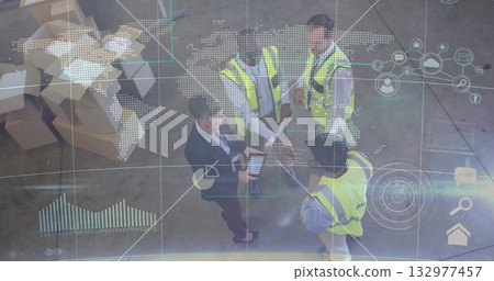Collaborating warehouse team in neon vests analyzing map overlay on tablet inside distribution hub Collaborating warehouse team in neon vests analyzing map overlay on tablet inside distribution hub 132977457