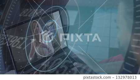 Man hosting meeting on laptop at desk, with gesturing woman on screen and floating data graphics Man hosting meeting on laptop at desk, with gesturing woman on screen and floating data graphics 132978013