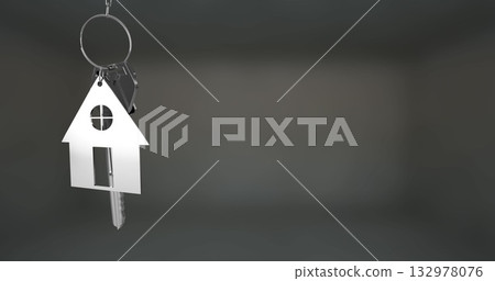 Hanging metallic house-shaped keychain and door key reflecting on dark grey backdrop, copy space Hanging metallic house-shaped keychain and door key reflecting on dark grey backdrop, copy space 132978076